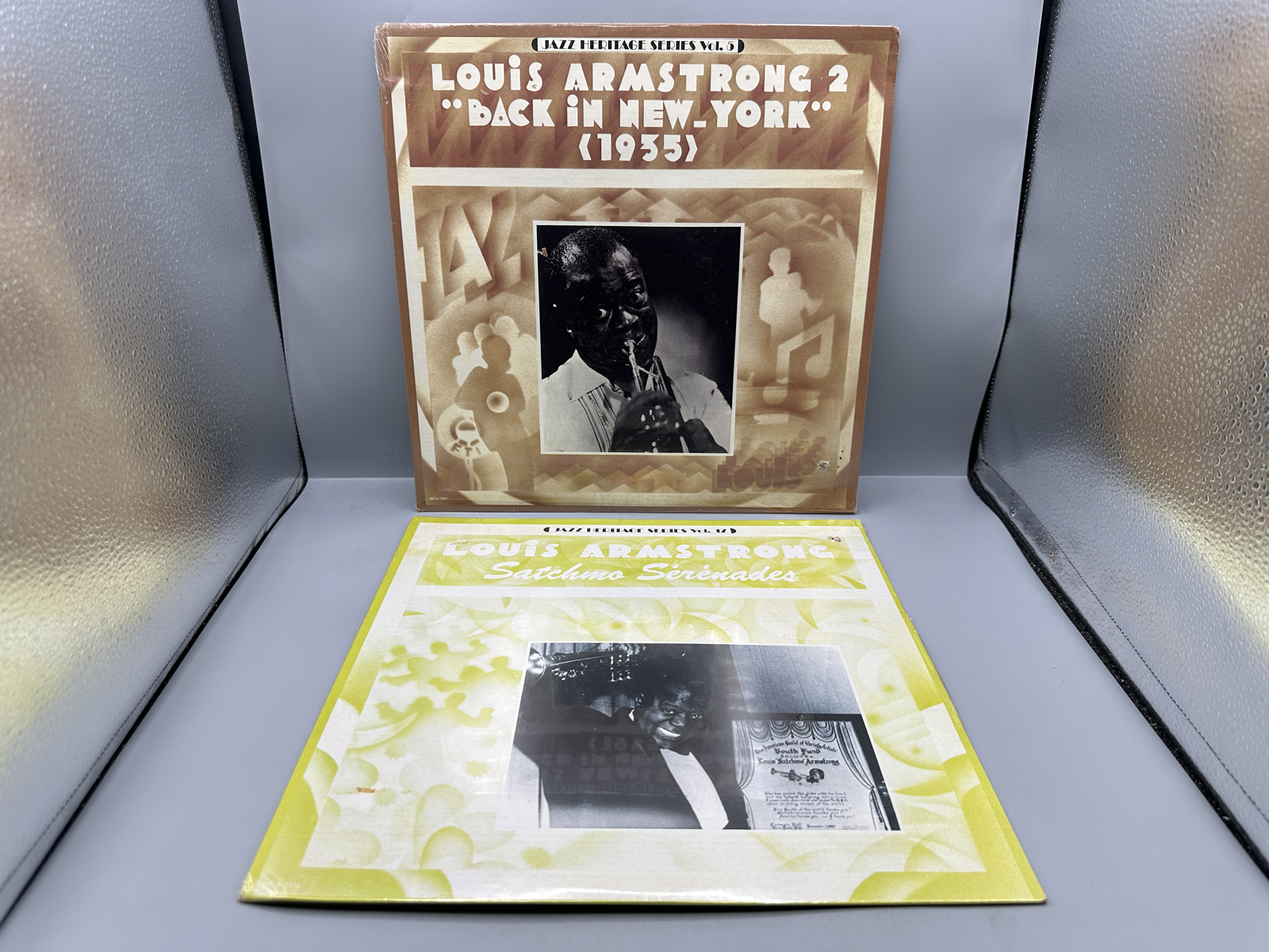 SEALED - Louis Armstrong (2 LP Lot): Back in New York - 1935 (1980); and Satchmo Serenades (1980), promo hole in cover. Both LPs are SEALED