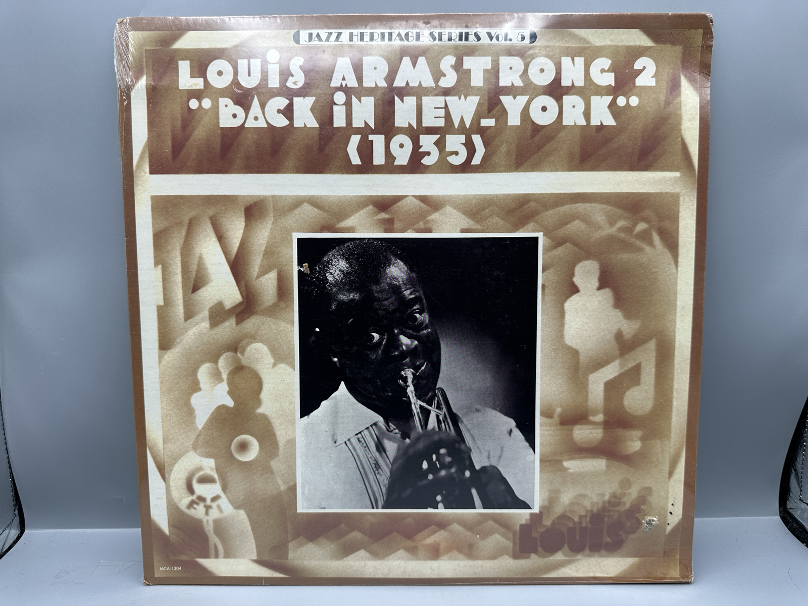 SEALED - Louis Armstrong (2 LP Lot): Back in New York - 1935 (1980); and Satchmo Serenades (1980), promo hole in cover. Both LPs are SEALED