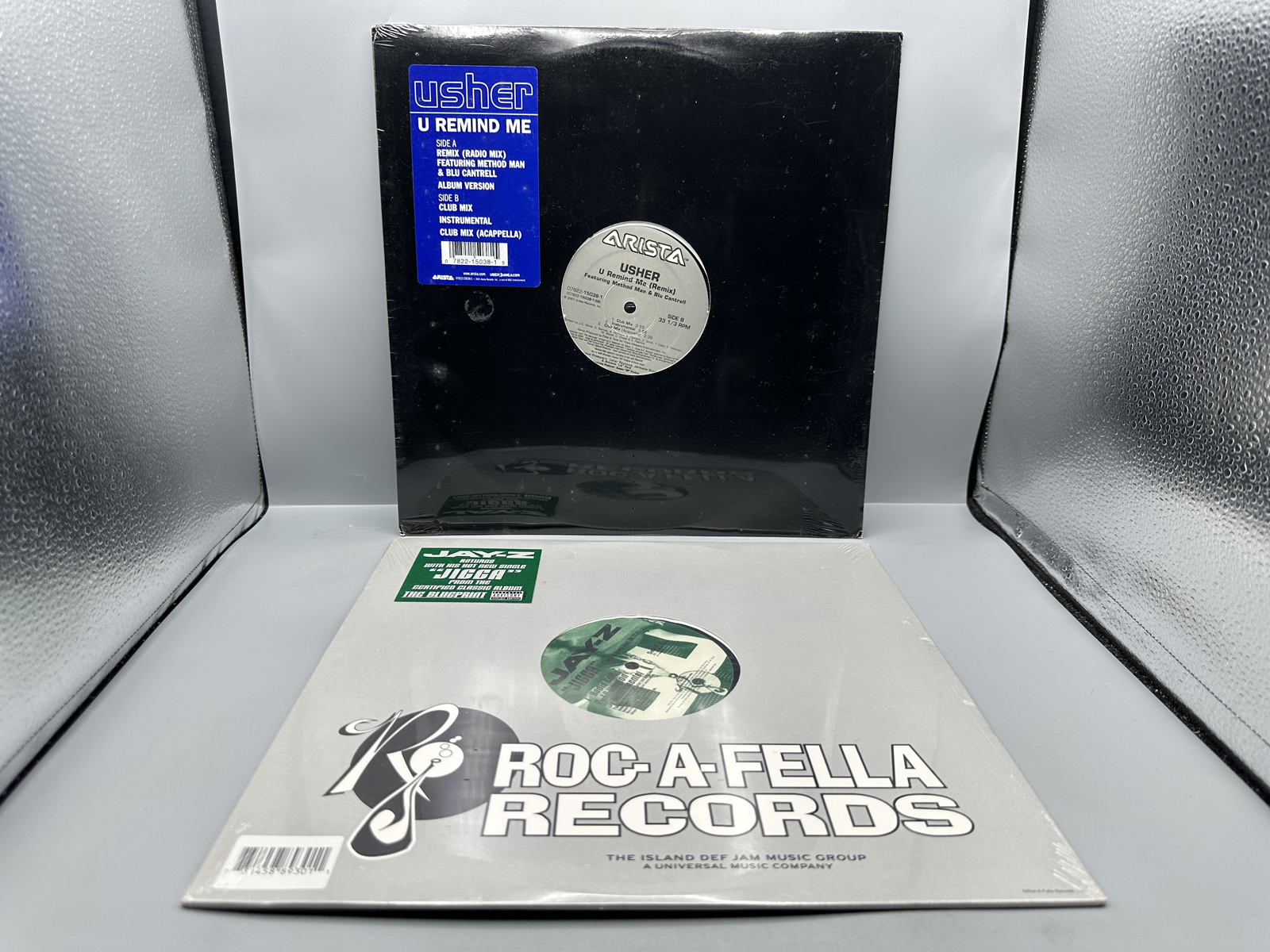 SEALED - Usher: U Remind Me (2001); and Jay-Z: Jigga (2001) This is a two (2) record lot - both are SEALED 12-inch, 33 1/3 rpm singles.