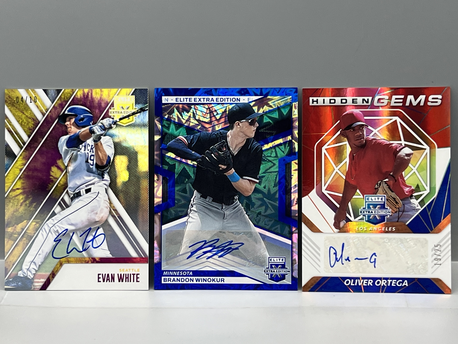 (3) Assorted Pack Pulled Low Serial Numbered Baseball Autos - Evan White #/10, Brandon Winokur #/15, & Oliver Ortega #/25