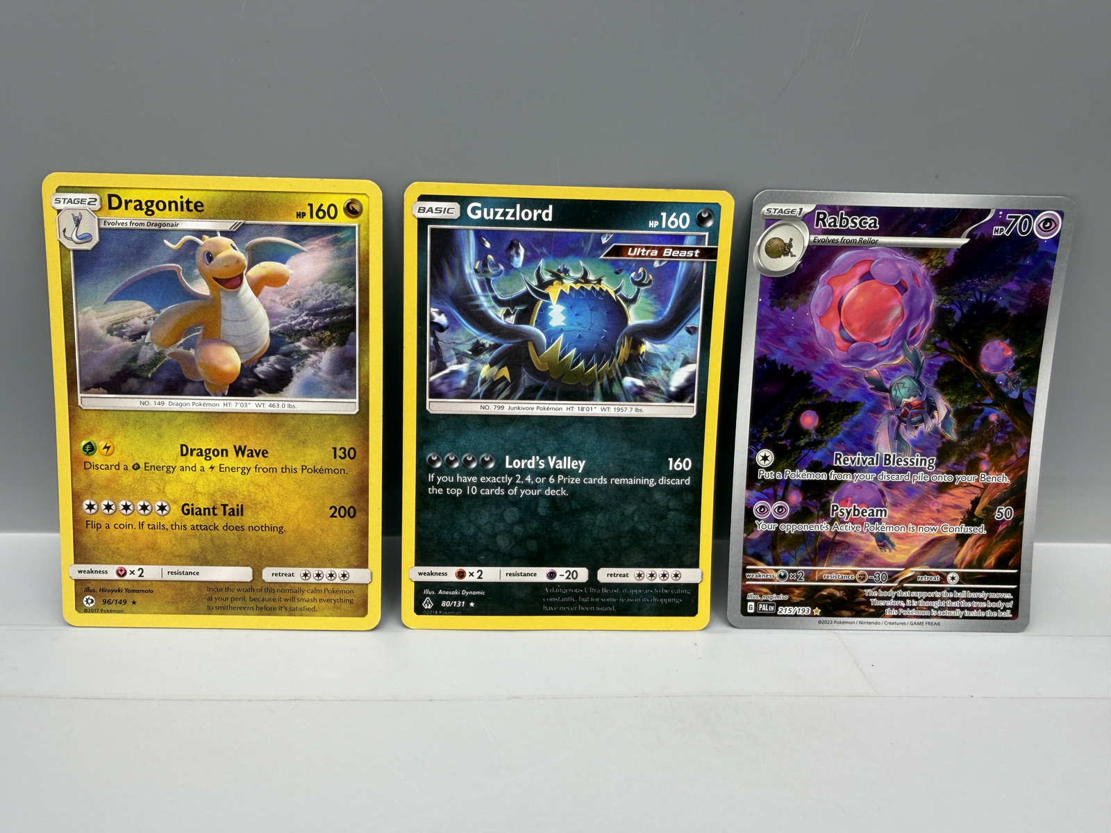 Pokemon Holo Lot of 3 - Dragonite, Guzzlord (crease), Rabsca