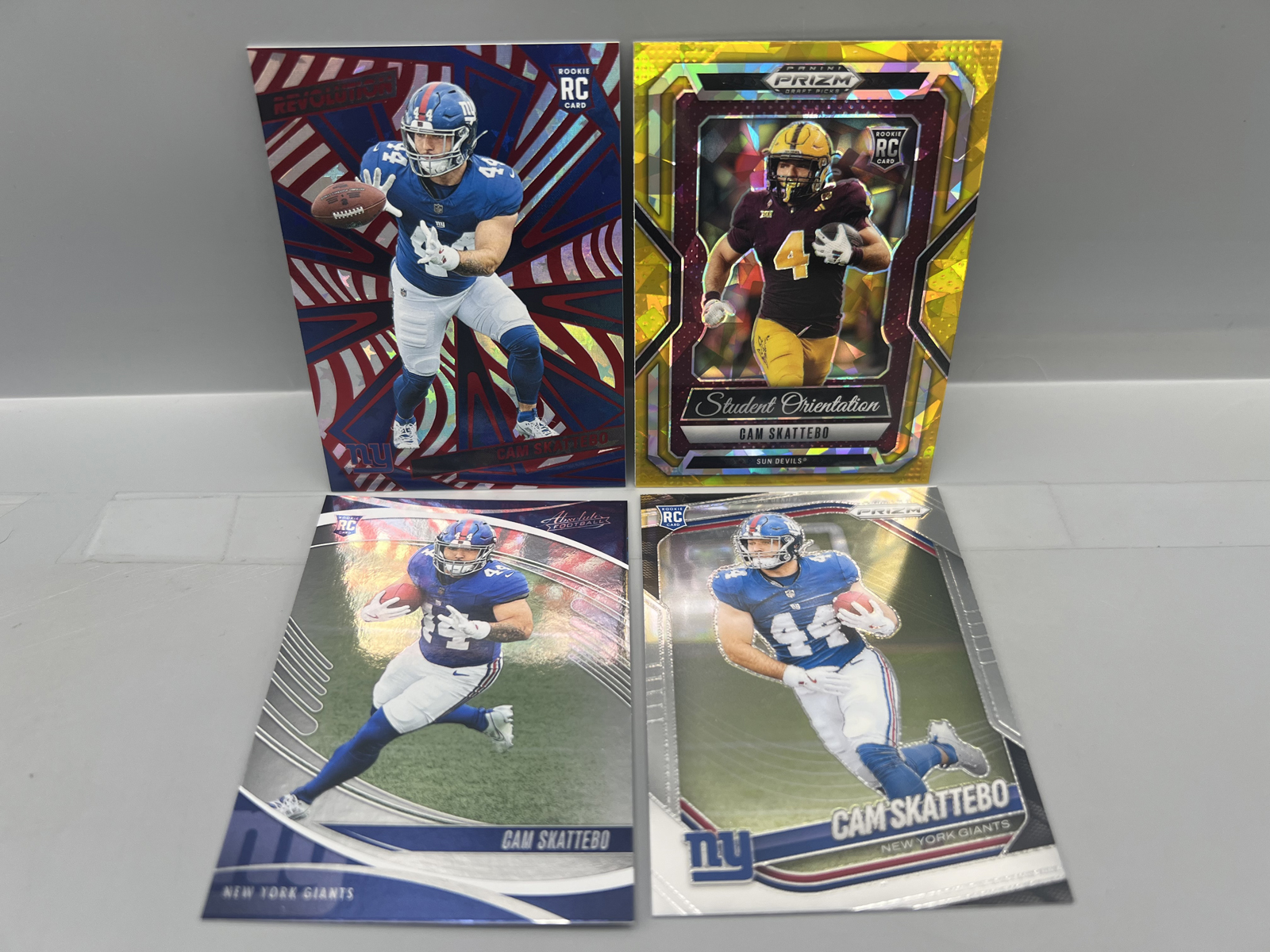 Lot of (4) Cam Skattebo Football Rookie Cards