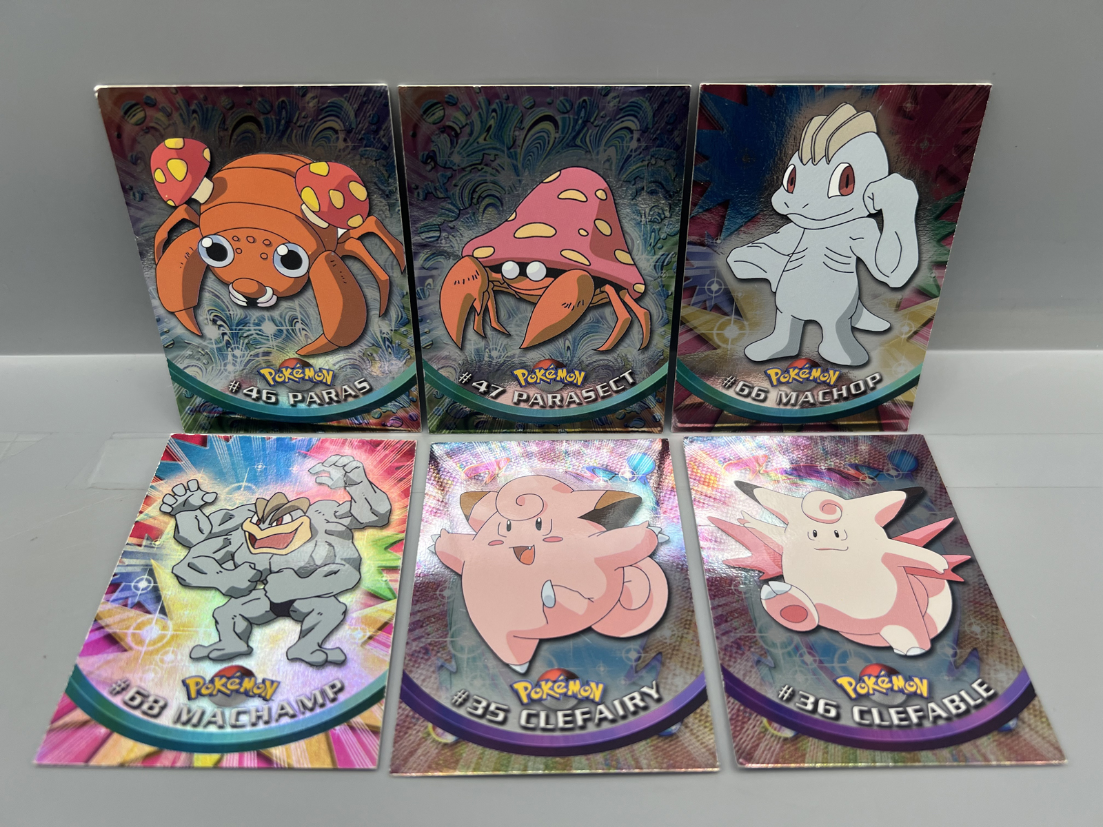 Lot of (6) 1999 Topps Pokemon TV 1st Print Blue Topps Logo Foil Trading Cards W/ Machamp Rainbow Foil - Varying Conditions