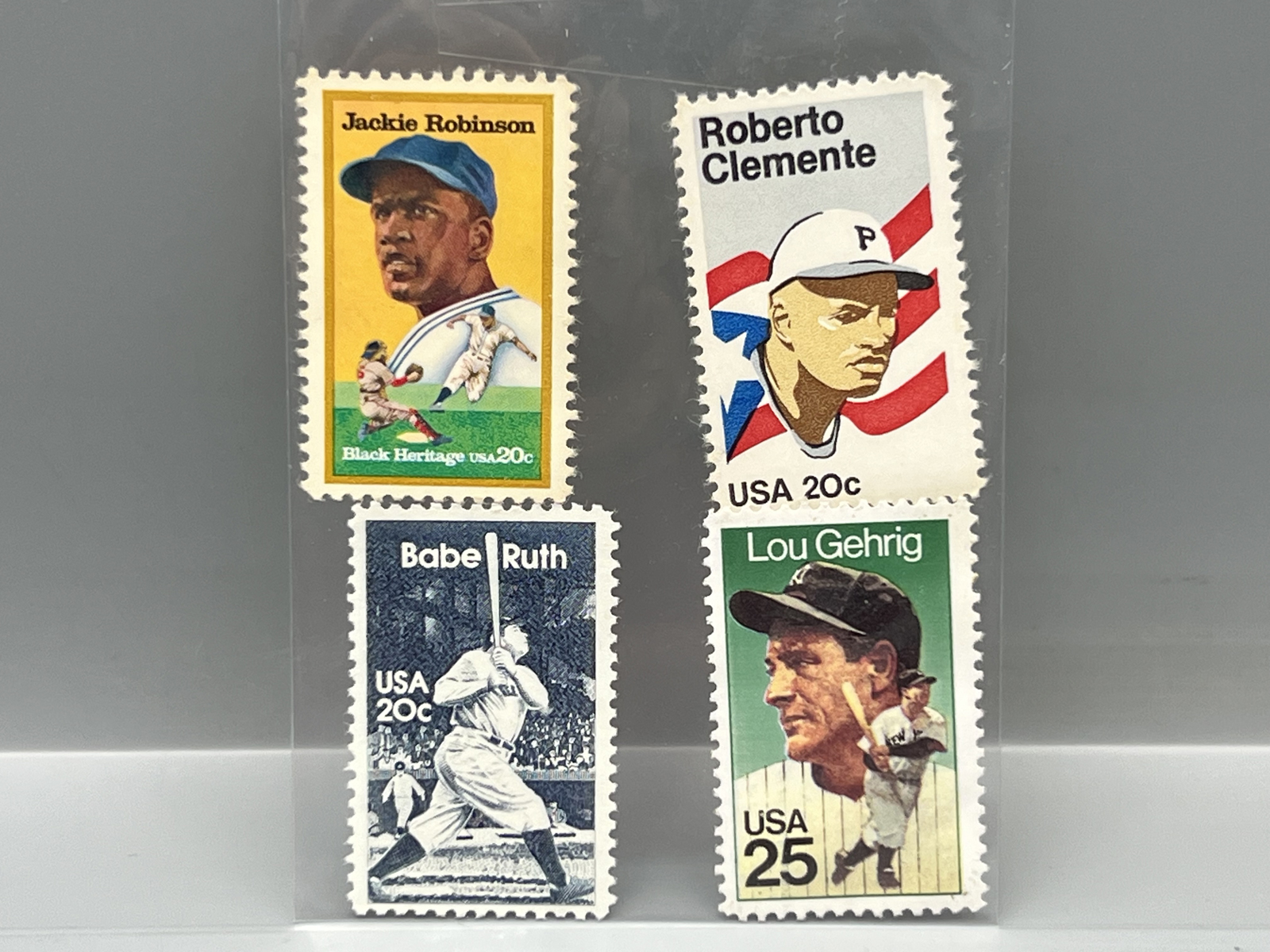 (4) Assorted Vintage Baseball Star Player Stamps - Babe Ruth, Jackie Robinson, Roberto Clemente, Lou Gehrig