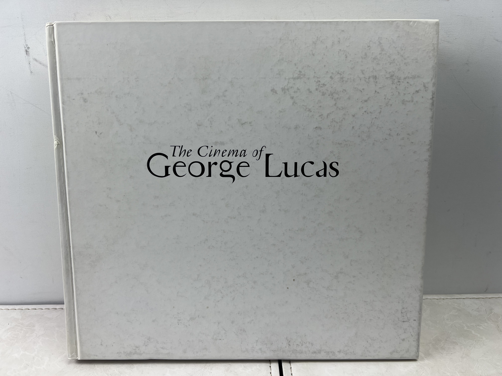 The Cinema of George Lucas Hardcover 2005 First Edition - wear to cover & water damage on interior