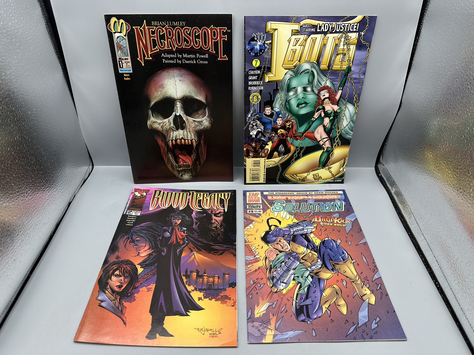 Malibu Comics, Tekno Comix, and Image Comics lot of 4 comics including Necroscope #1, I-Bots #7, Blood Legacy #2, and The Solution #5 (1992-