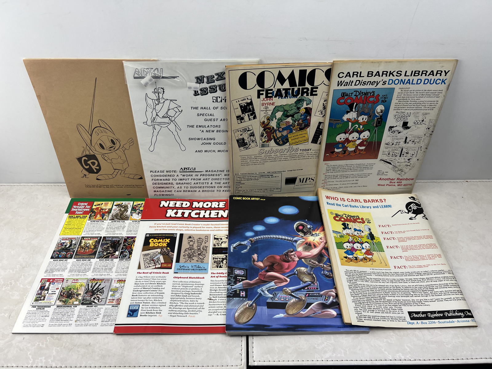 Assortment of Comic Industry Magazines and Reference Publications - Krause, TwoMorrows, and Others