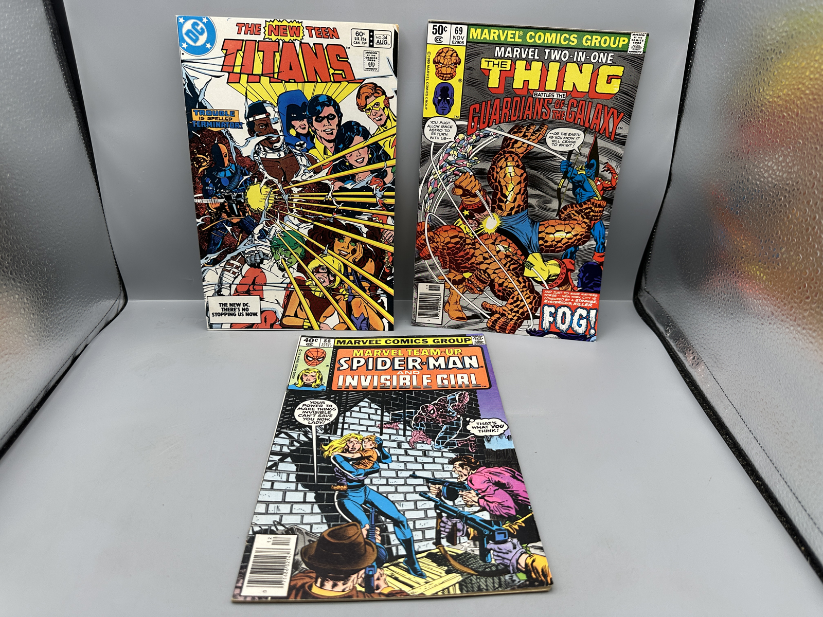 Lot of 3 Misc Comic Books featuring Marvel Team-Up #88, Marvel Two-In-One #69, and The New Teen Titans #34