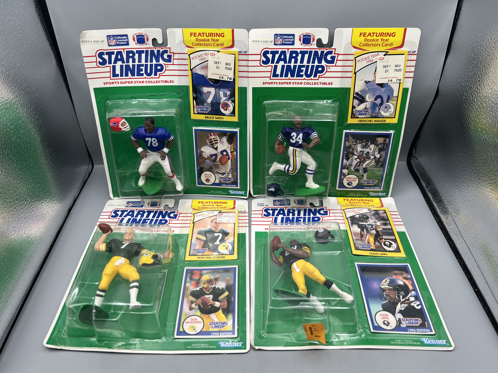 (4) 1990 Kenner Starting Lineup Football Figures - Bruce Smith, Herschel Walker, Louis Lipps, Don Majkowski