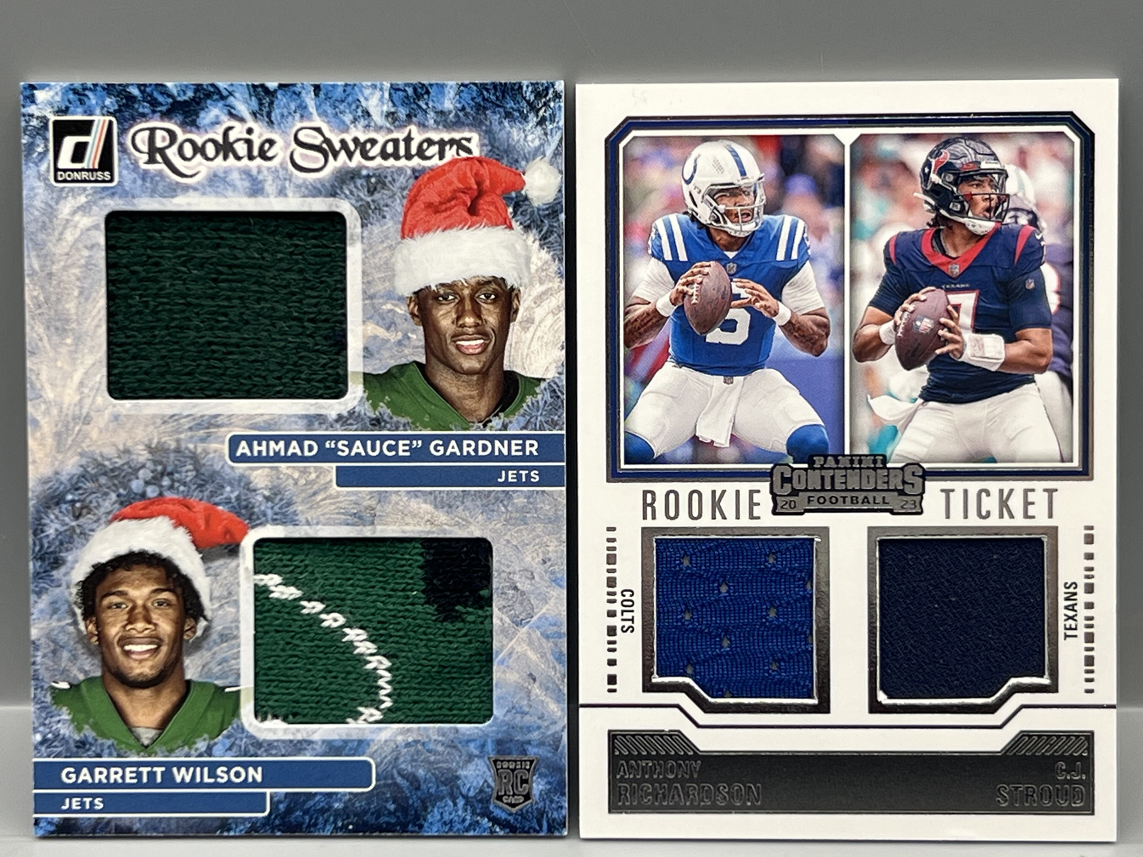 2022 Panini Donruss Sauce Gardner/Garrett Wilson Rookie Sweaters Dual Relic & 2023 Panini Contenders Anthony Richardson/CJ Stroud Dual RC Re