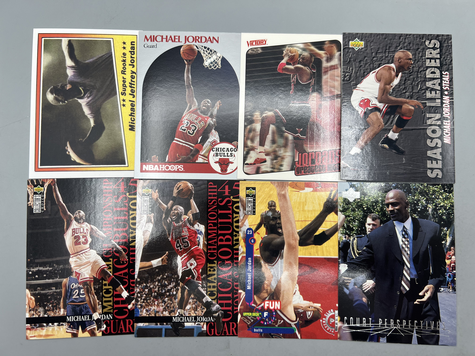 (8) Michael Jordan Basketball Cards - One is a custom football card