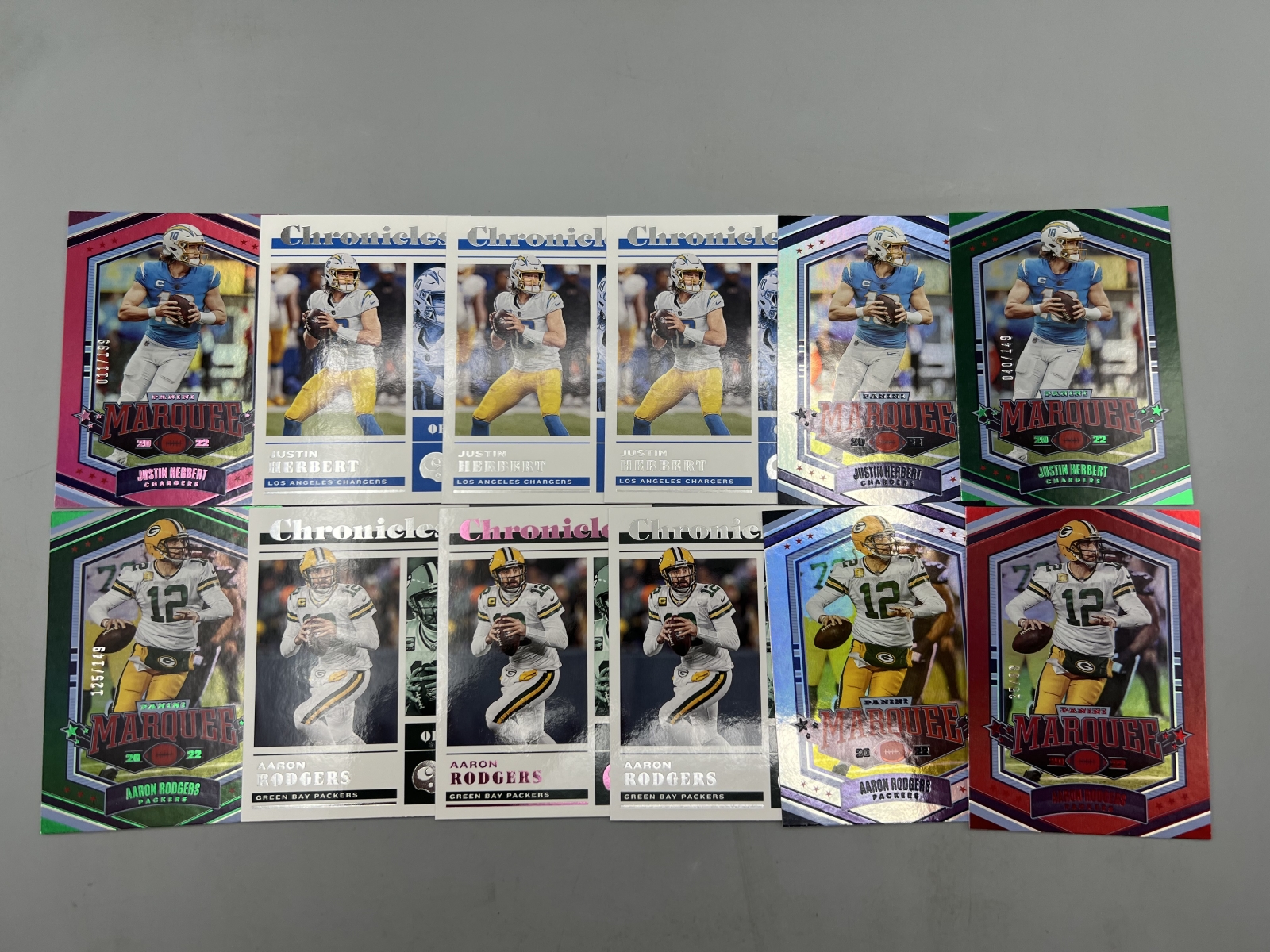 (12) 2022 Panini Chronicles Football Justin Herbert & Aaron Rodgers Cards W/ Parallels & Serial Numbered
