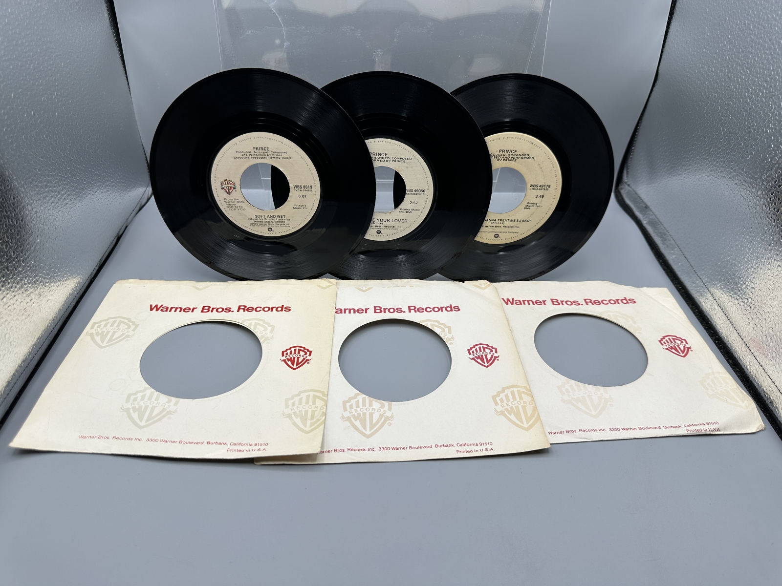 Prince: Three (3) of his early 7-inch 45 rpm records: Soft And Wet (1978); I Wanna Be Your Lover (1979); and Why You Wanna Treat Me So Bad? 
