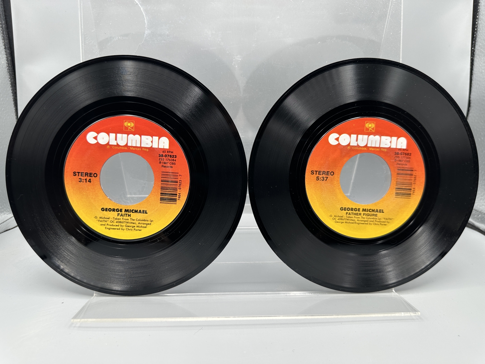 George Michael: Six (6) 7-inch 45 rpm records with picture sleeves: Faith (1987); Father Figure (1987); Monkey (1988); Kissing A Fool (1988)