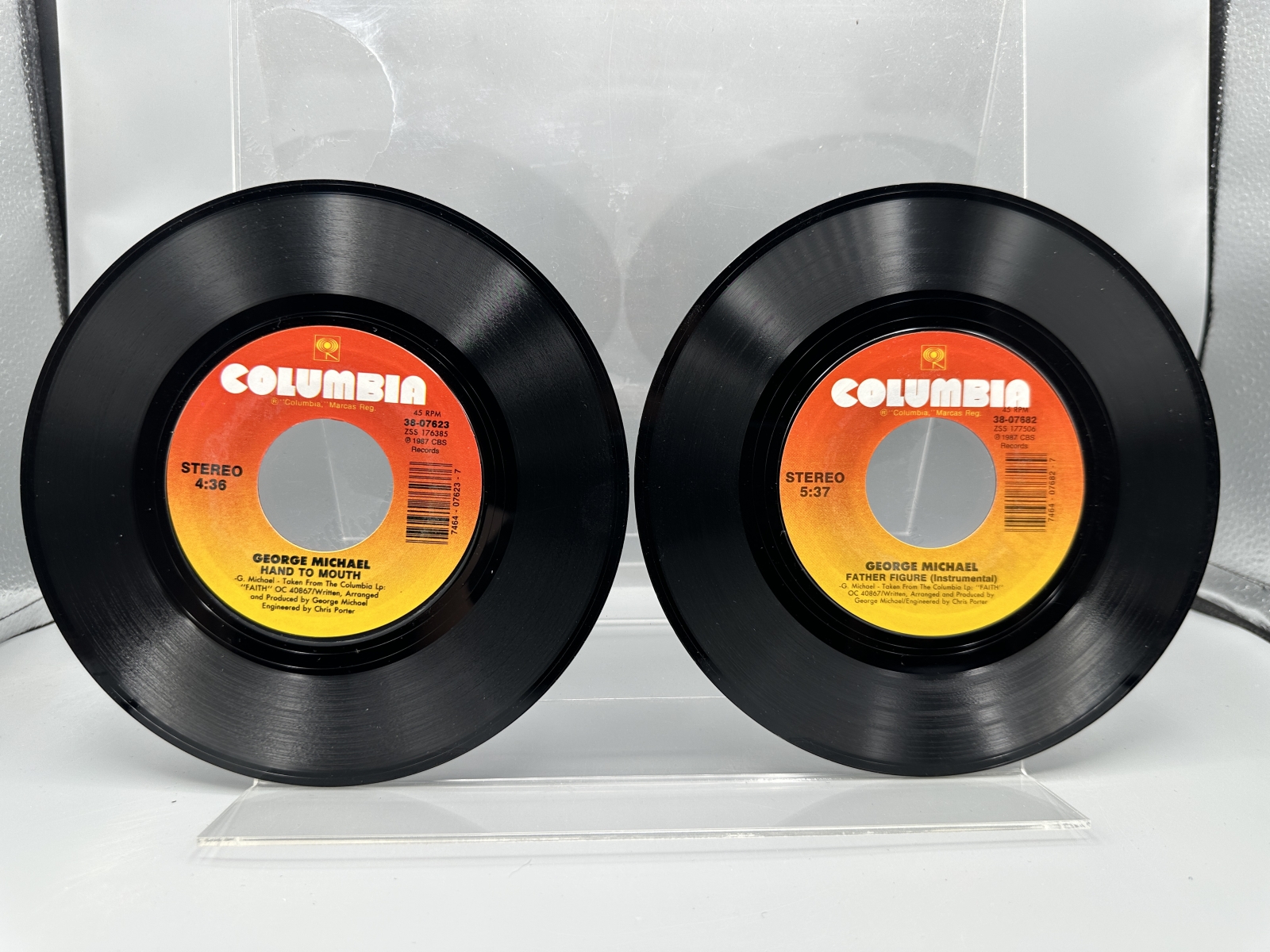 George Michael: Six (6) 7-inch 45 rpm records with picture sleeves: Faith (1987); Father Figure (1987); Monkey (1988); Kissing A Fool (1988)