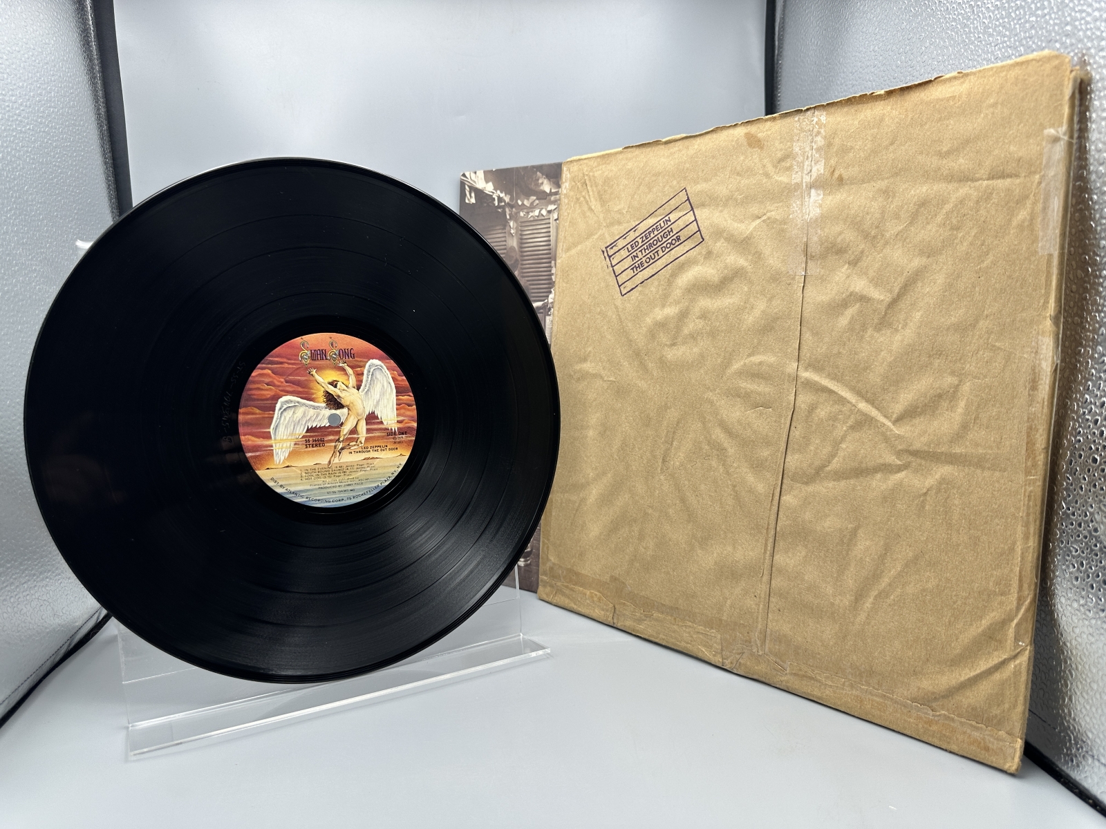 Led Zeppelin: In Through The Out Door (1979), Cover is Version 'C', outer sleeve (stamped paper bag) is included (but taped at seams), previ