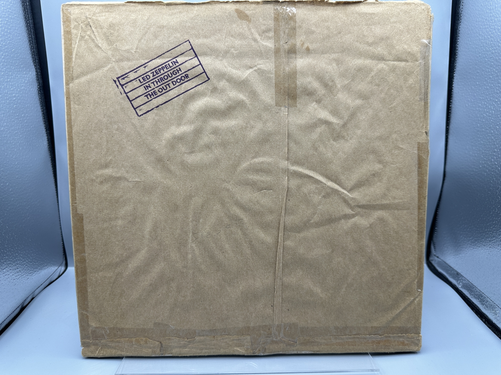 Led Zeppelin: In Through The Out Door (1979), Cover is Version 'C', outer sleeve (stamped paper bag) is included (but taped at seams), previ