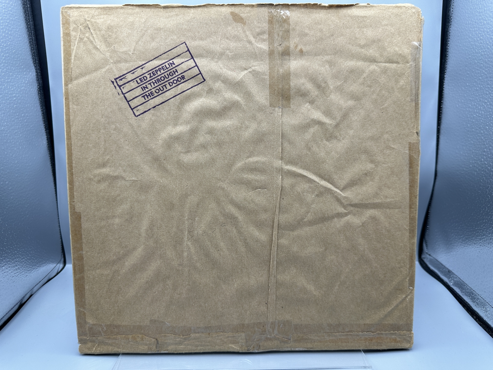Led Zeppelin: In Through The Out Door (1979), Cover is Version 'C', outer sleeve (stamped paper bag) is included (but taped at seams), previ
