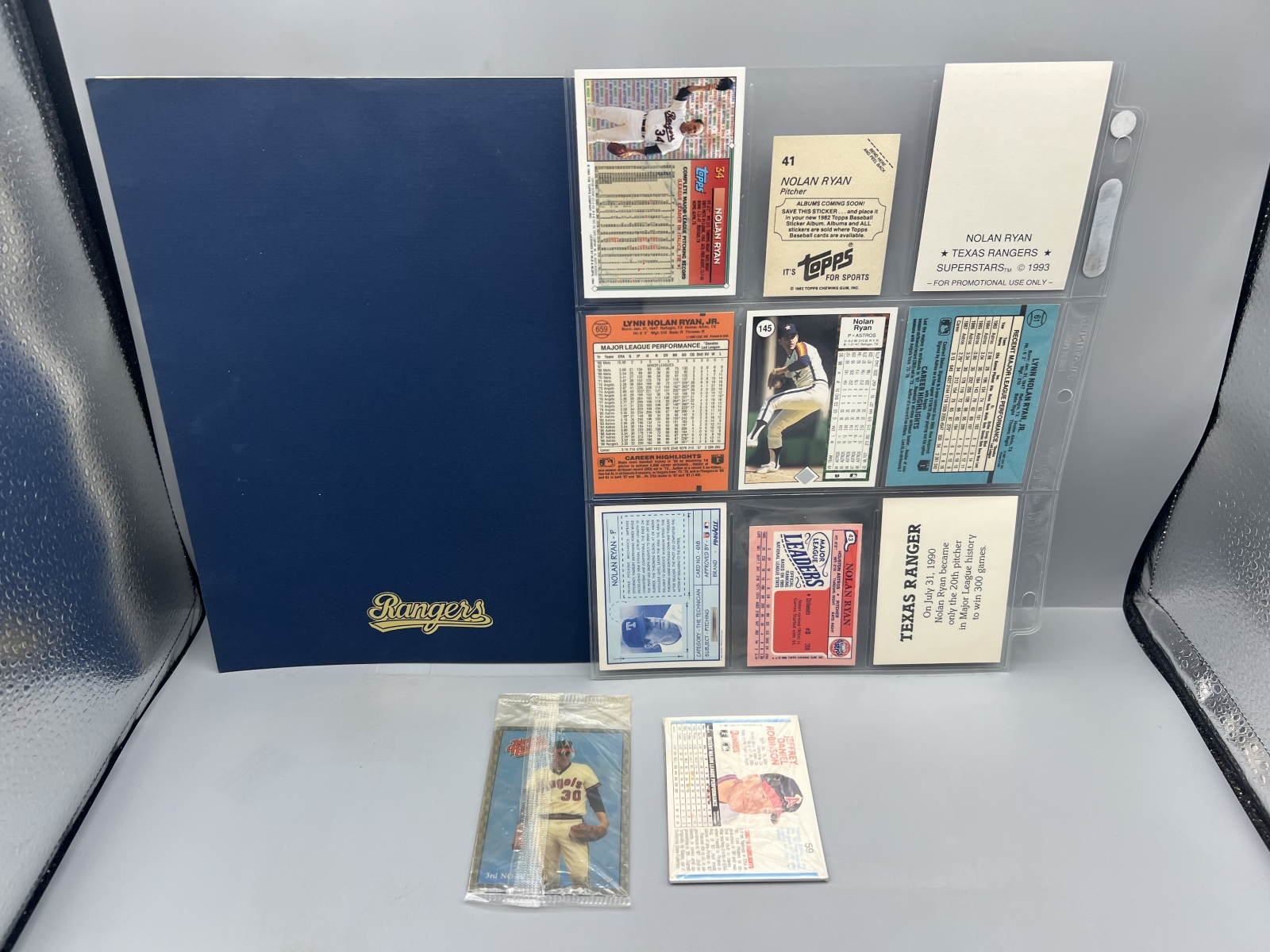 Assorted Nolan Ryan Memorabilia Lot W/ Cards, Unopened Packs, & 7th No Hitter Commemorative Program