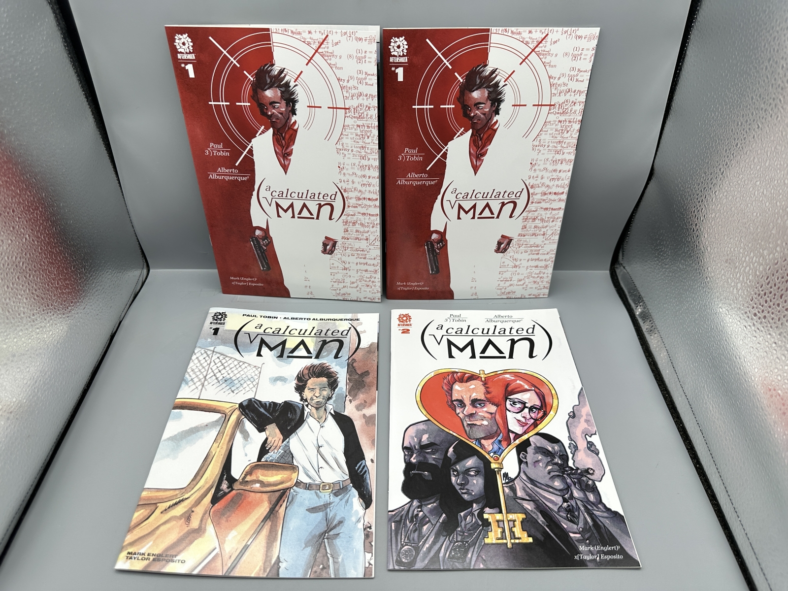 AfterShock Comics lot of 8 comics including Miskatonic #1, Chicken Devil #1, There's Something Wrong With Patrick Todd #1-2, and A Calculate