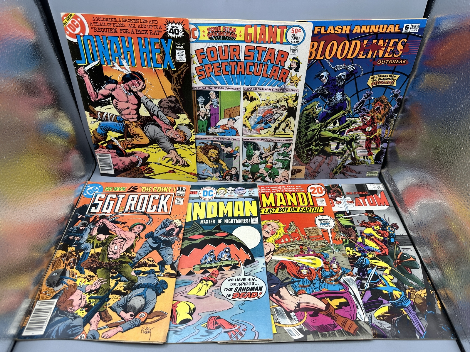 (7) DC Comic Books - Including Jonah Hex #22 (1979), Four Star Spectacular #1 (1976), Flash Annual #6 (1993) - 1st appearance of Argus, and 
