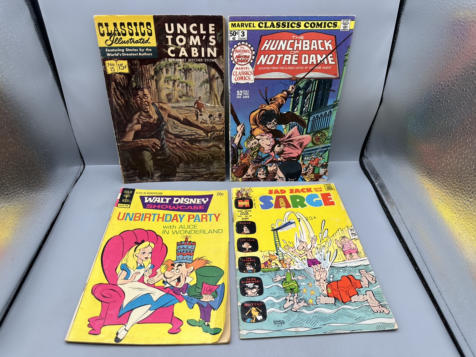(4) Gilberton, Marvel, Gold Key, and Harvey Comics - Classics Illustrated #15, Marvel Classics Comics #3, Walt Disney Showcase #18, Sad Sack