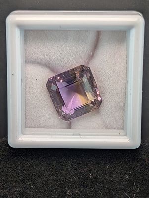 Square Emerald-Style Cut Stone, Approx. 6.69 Carats. A square emerald-style cut stone described 