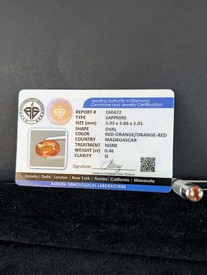 Oval Orange Stone, Approx. 0.46 Carats (Aurora Certification). An oval-shaped orange stone 