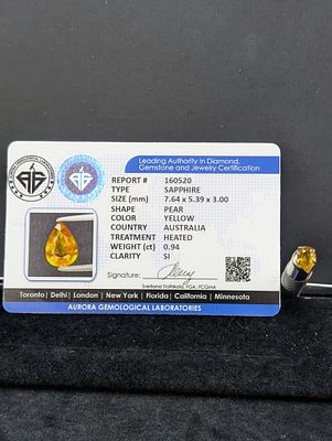 Pear-Shaped Yellow Stone, Approx. 0.94 Carats (Aurora Certification). A pear-shaped yellow stone 