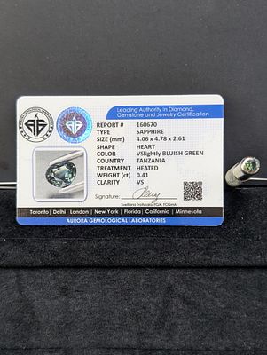 Heart-Shaped Bluish-Green Stone, Approx. 0.41 Carats (Aurora Certification). A heart-shaped 