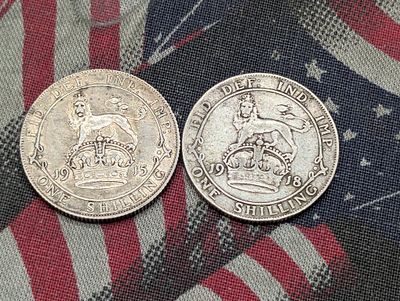 (2) Great Britain One Shilling Coins 1915, 1918 - 92.5% - 5.6552g Each. (2) Great Britain One 