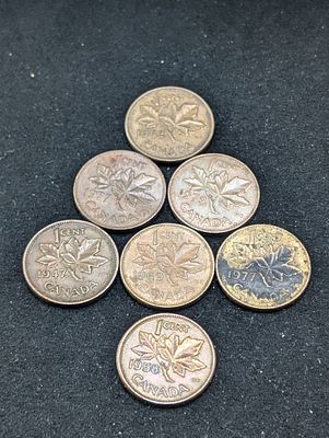 Seven Canadian One Cent Coins - 1947 (Maple Leaf), 1958, 1962, 1969, 1973, & (2) 1977. Seven 