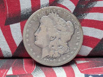 1892-CC Morgan Silver Dollar. Condition PLEASE NOTE Some coins may have a grade on the package 