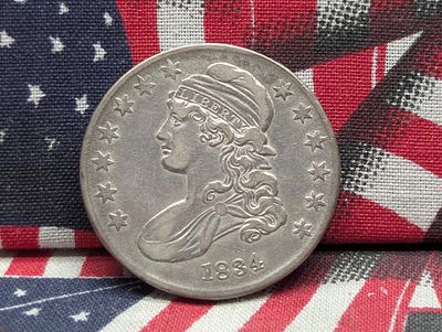 1834 Capped Bust Half Dollar. Condition PLEASE NOTE Some coins may have a grade on the package 