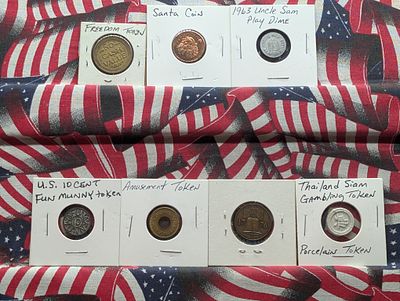 Seven US and International Exonumia and Play Money Condition PLEASE NOTE Some coins may have a 