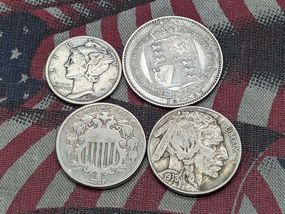 1867 Shield Nickel, 1887 Great Britain Shilling, 1931-D Mercury Dime, & 1938-D Indian Head 