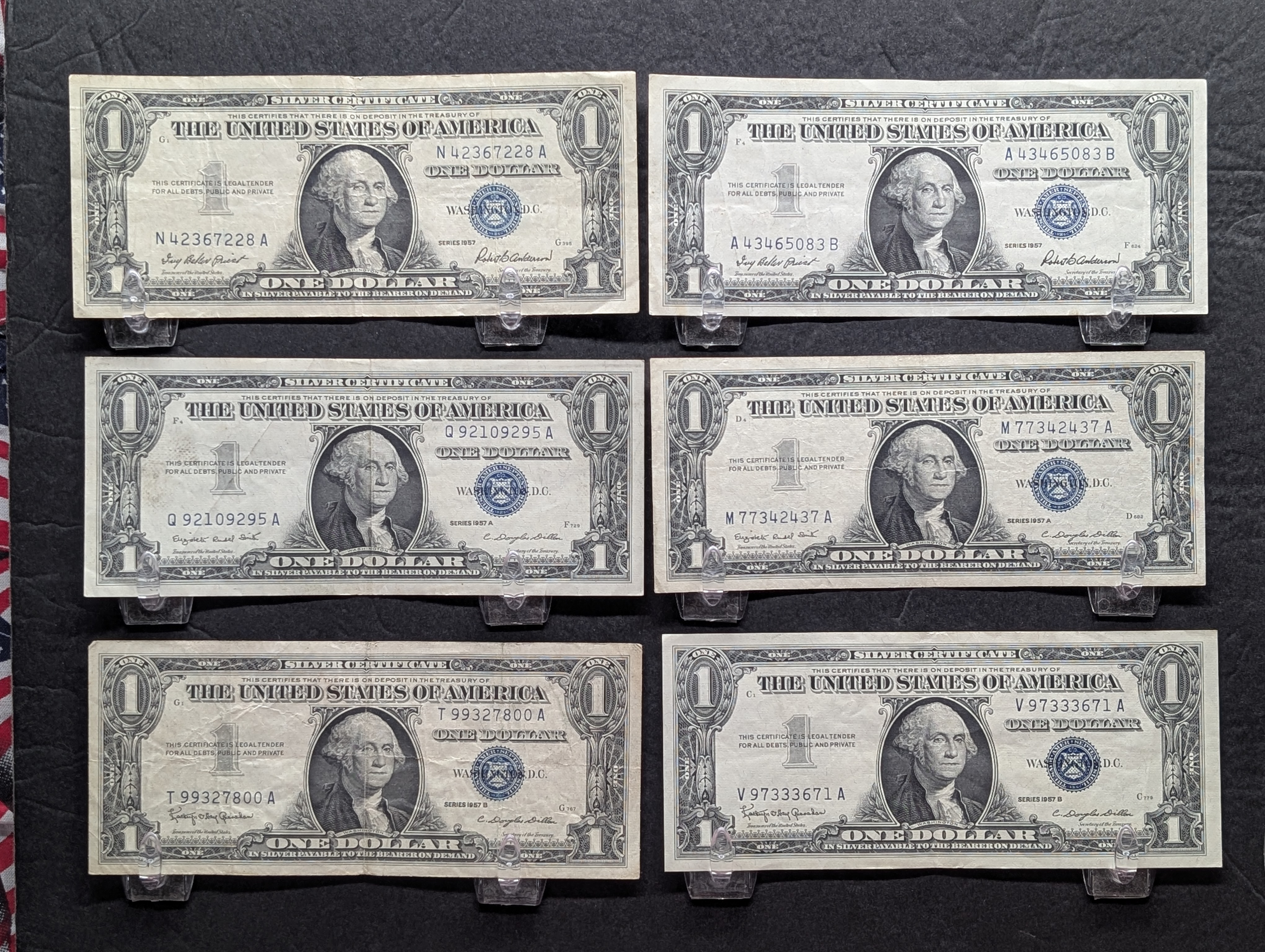 (2) 1957, (2) 57-A, (2) 57-B Series $1.00 Silver Certificates