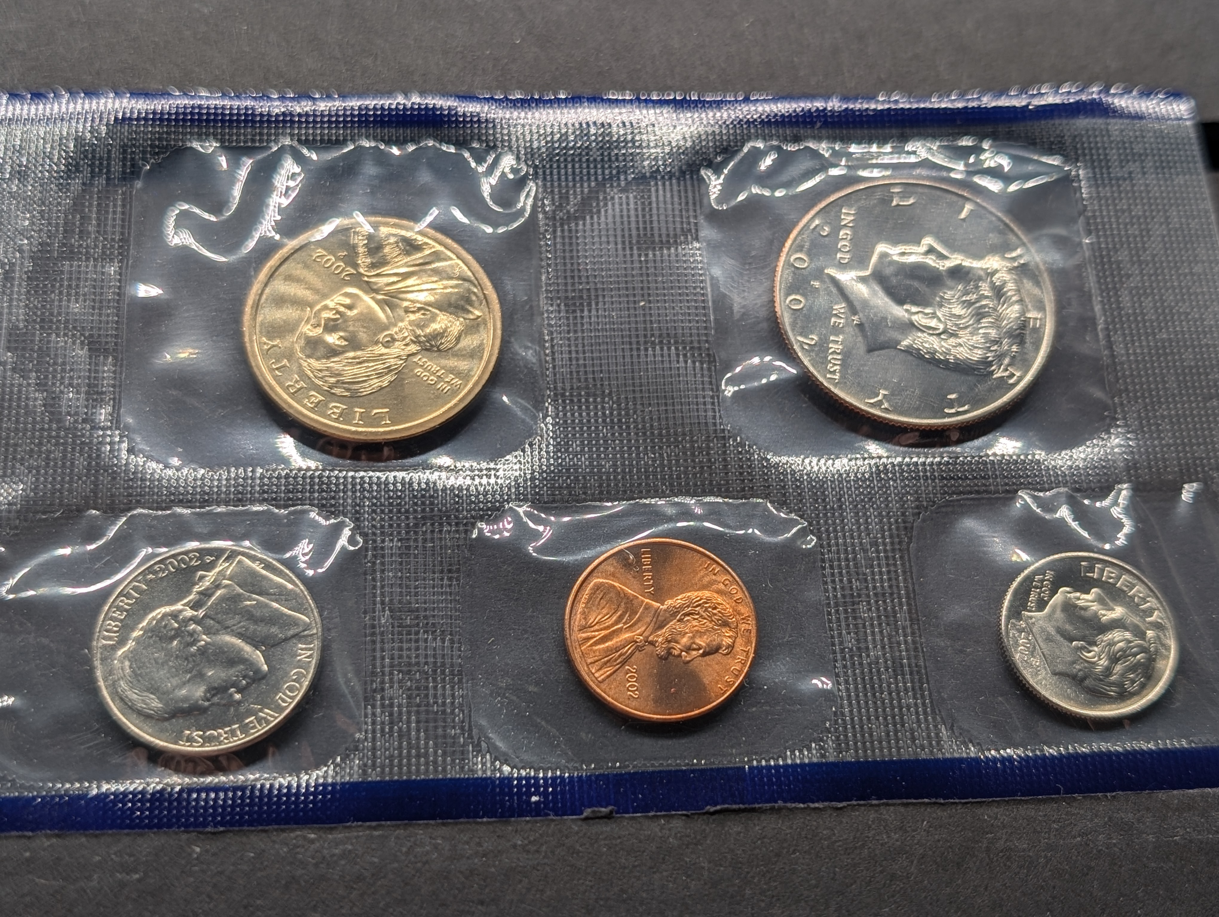2002-P&D Unc. U.S. Mint Set with State Quarters and Sacagawea Dollar in OGP w/ COA