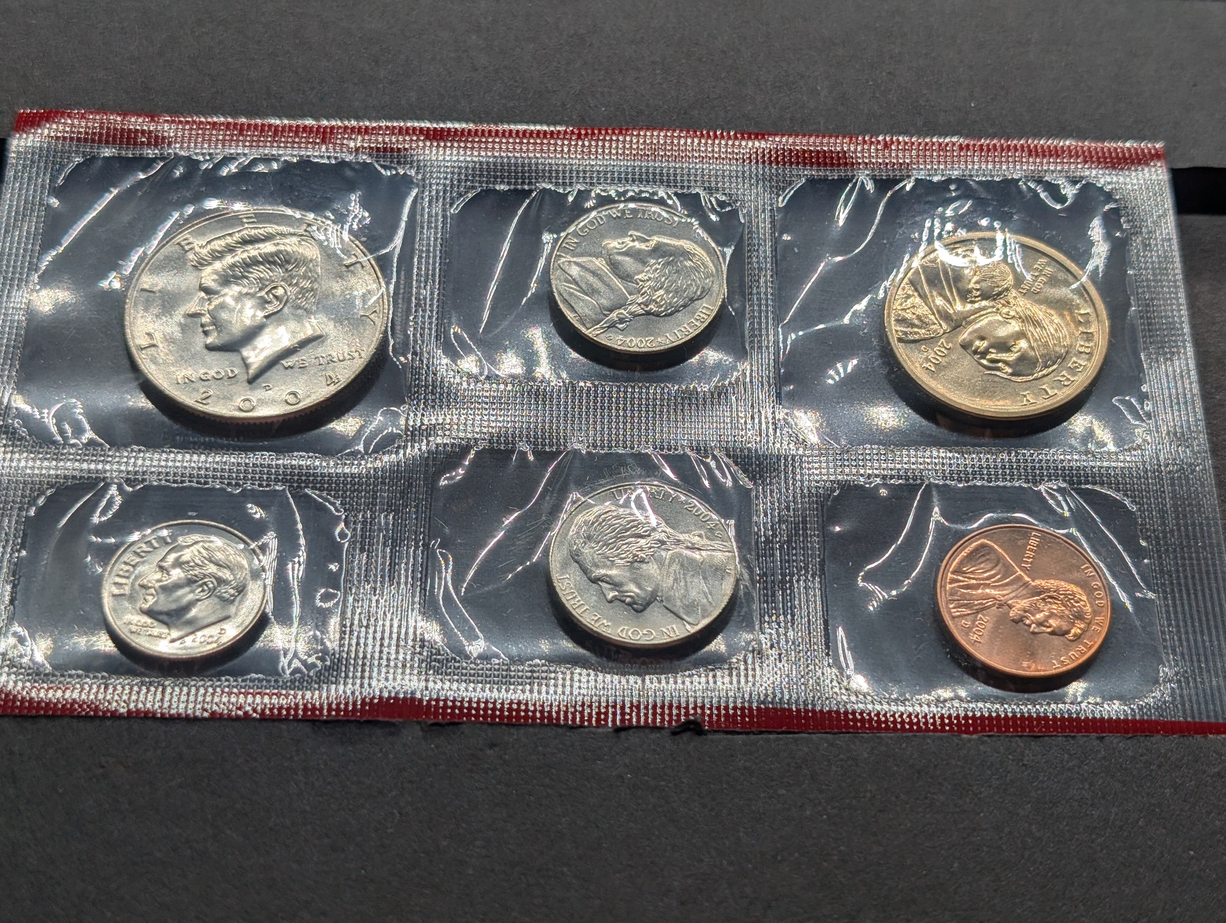 2004-P&D Unc. U.S. Mint Set with State Quarters and Sacagawea Dollar in OGP w/ COA