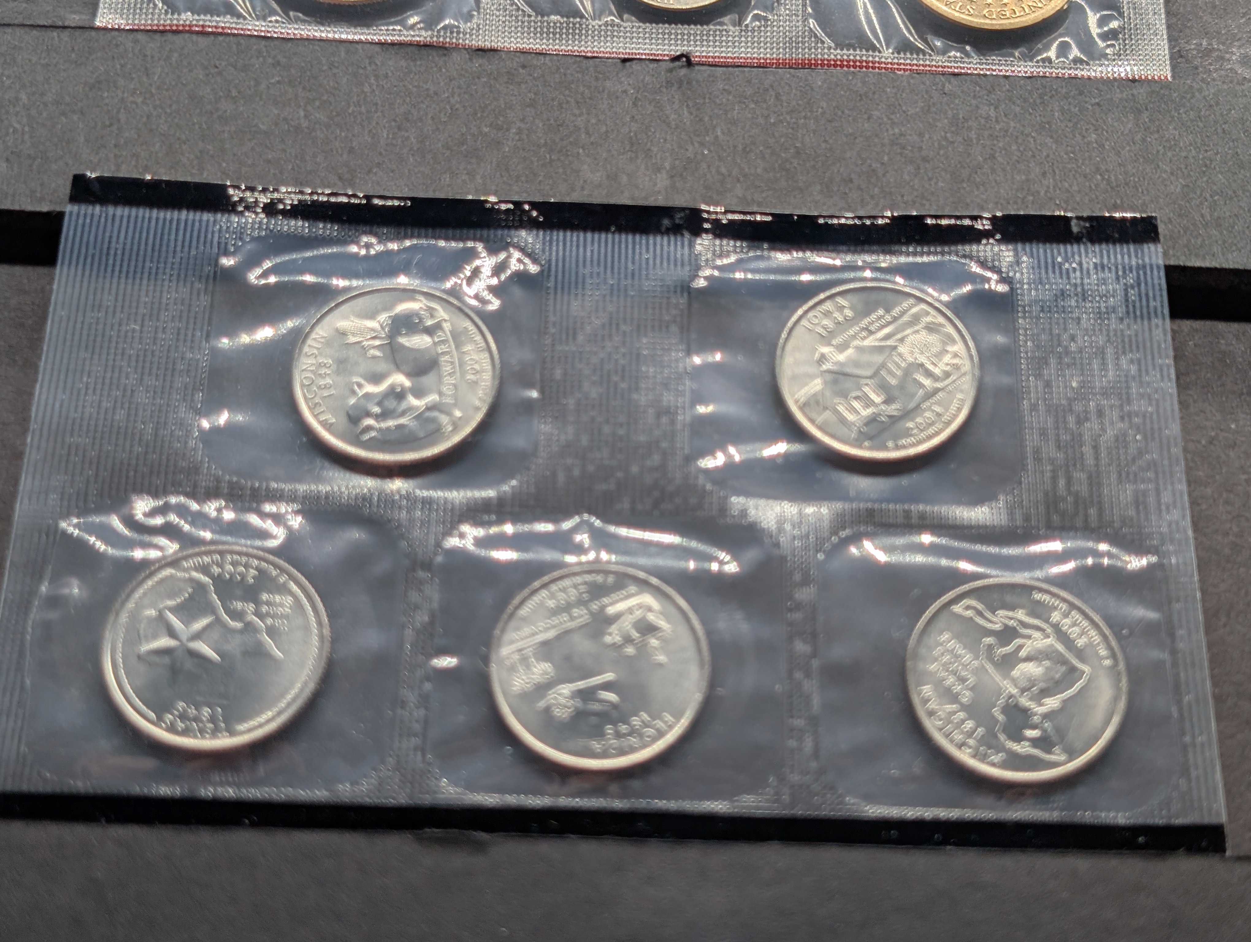 2004-P&D Unc. U.S. Mint Set with State Quarters and Sacagawea Dollar in OGP w/ COA
