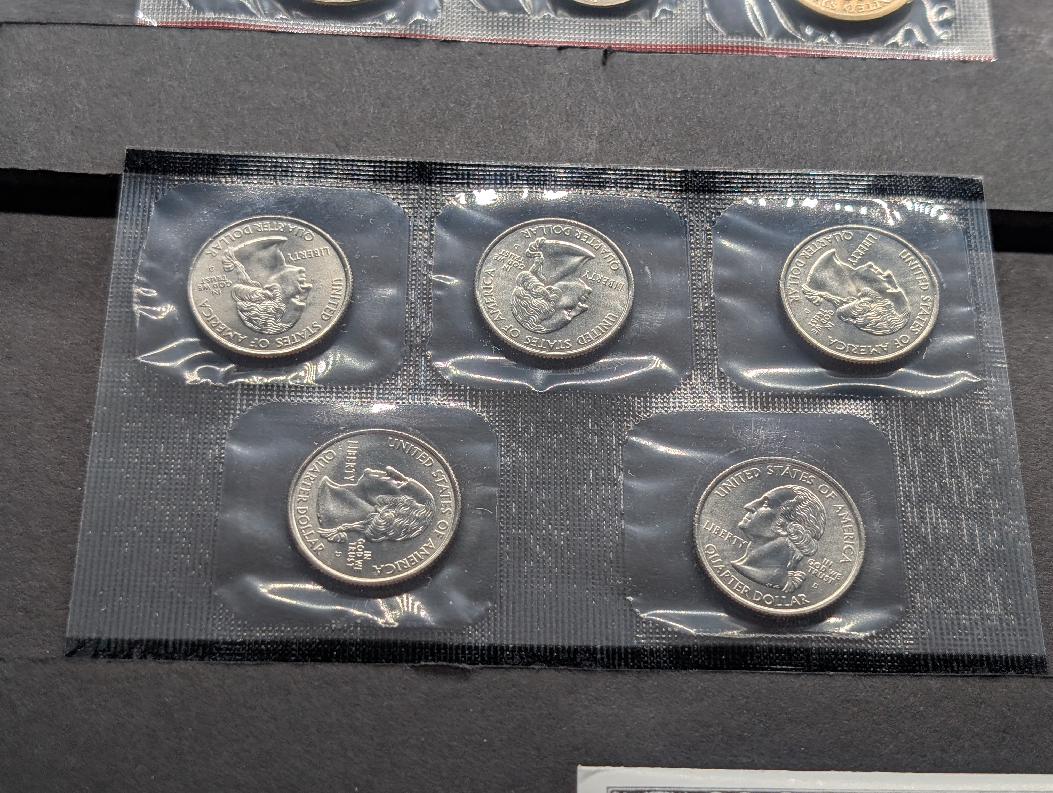 2004-P&D Unc. U.S. Mint Set with State Quarters and Sacagawea Dollar in OGP w/ COA