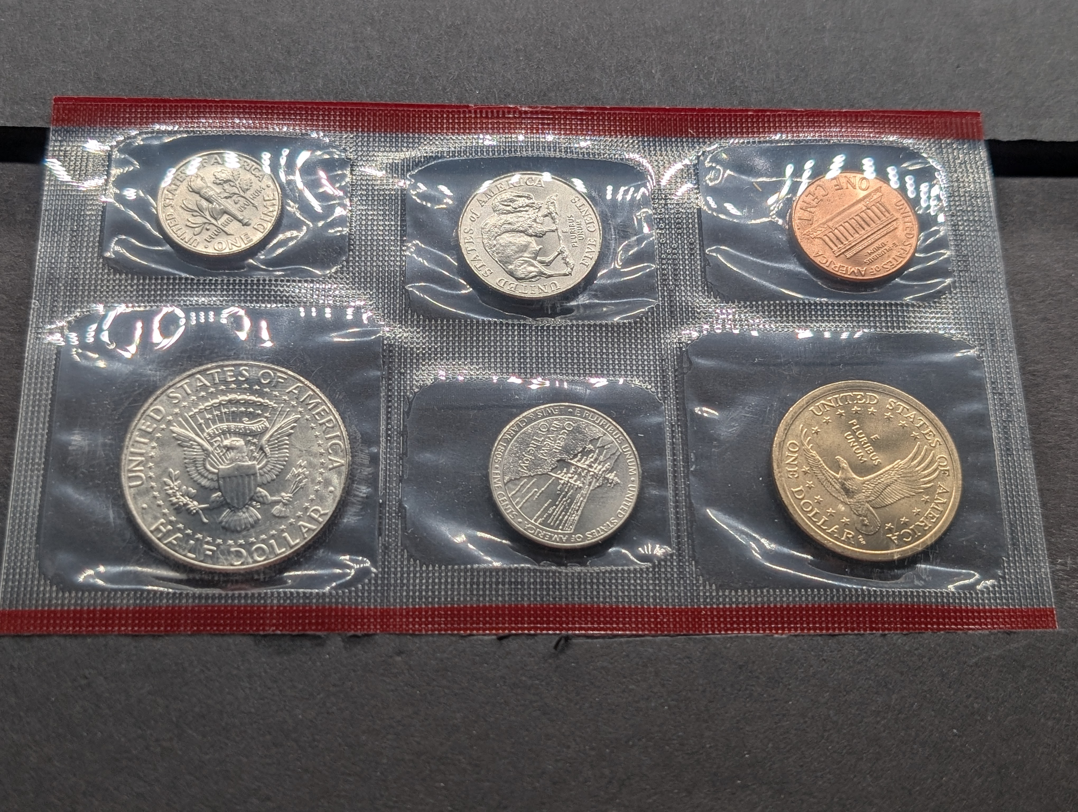 2005-P&D Unc. U.S. Mint Set with State Quarters and Sacagawea Dollar in OGP w/ COA