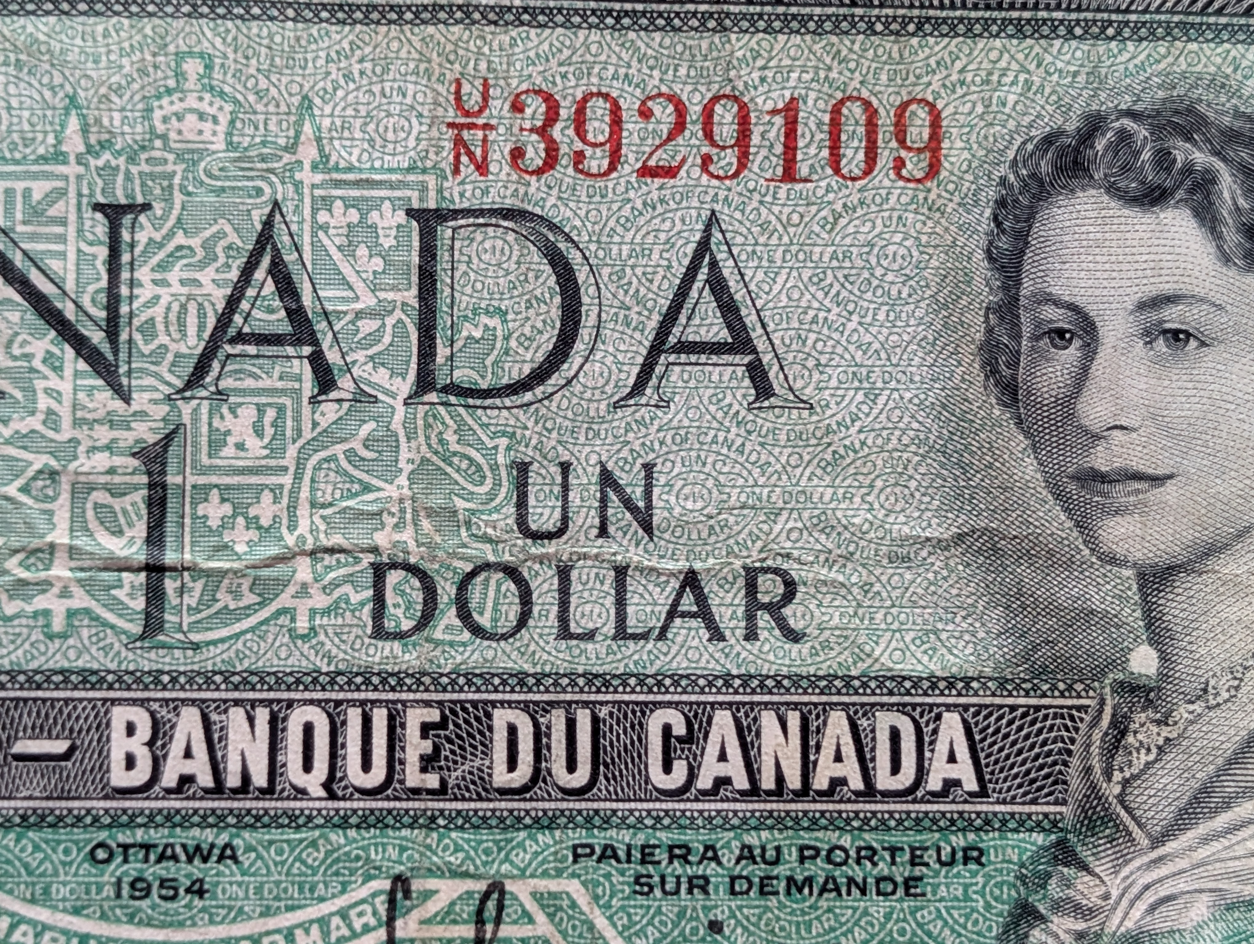 (2) Assorted World Banknotes - Canada $1 and Dominican Republic 1-Peso