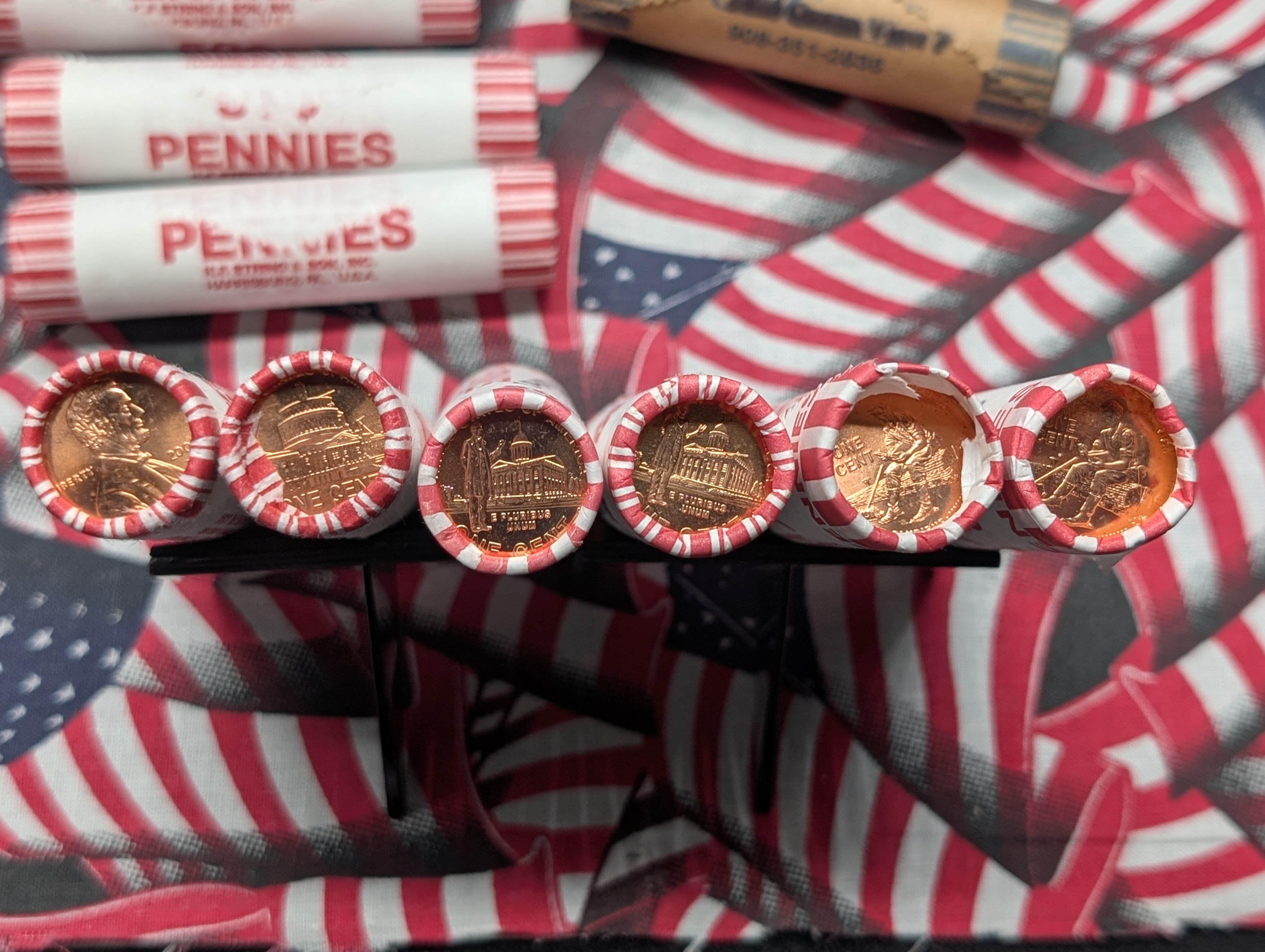 10 Rolls of 2009-P&D Lincoln Cents, 10 Rolls of Mixed Dates Lincoln Wheat Cents, 3 Rolls of 2004-P Keelboat Nickels and 2 Rolls of 2005-P Oc