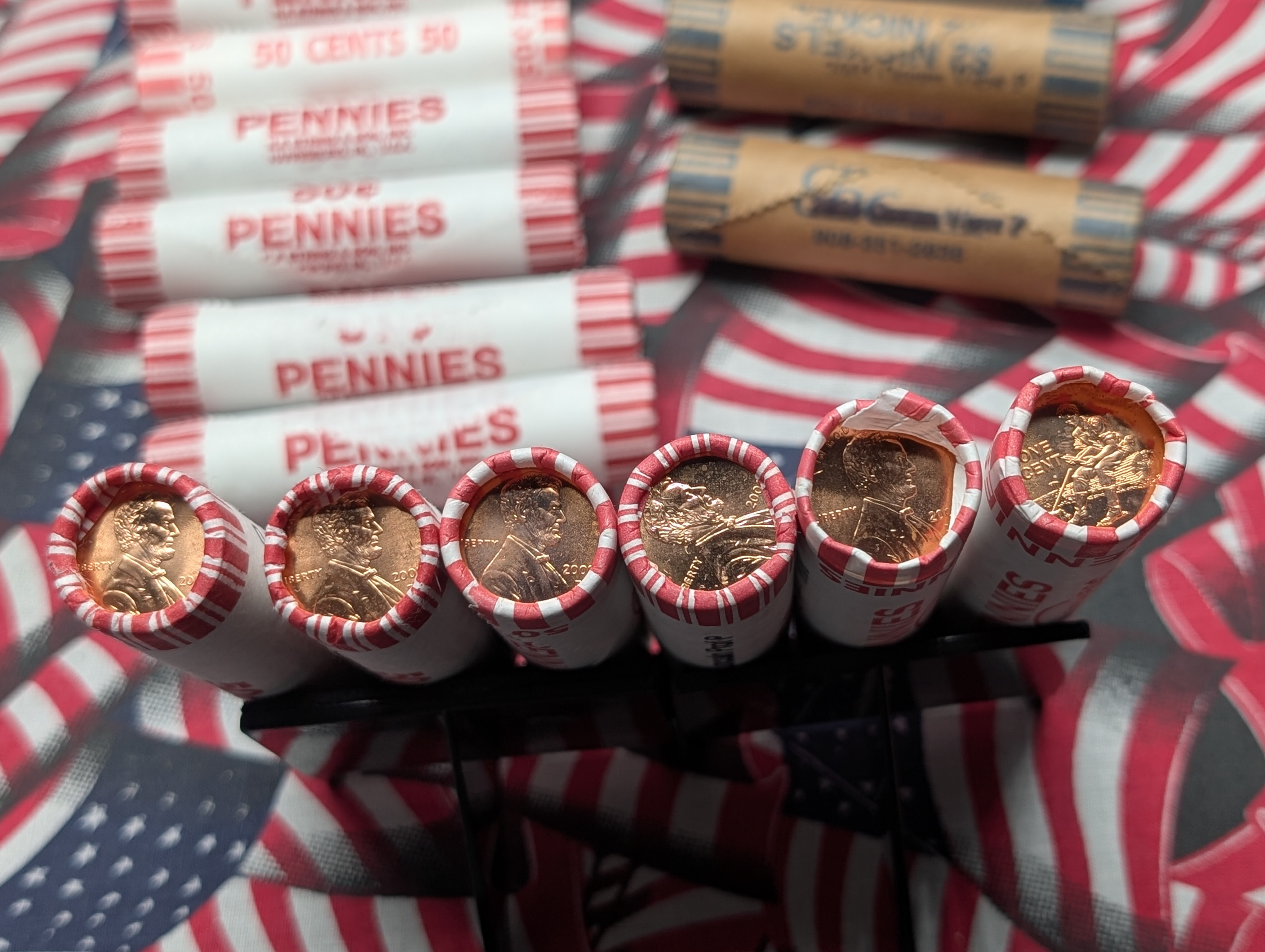 10 Rolls of 2009-P&D Lincoln Cents, 10 Rolls of Mixed Dates Lincoln Wheat Cents, 3 Rolls of 2004-P Keelboat Nickels and 2 Rolls of 2005-P Oc