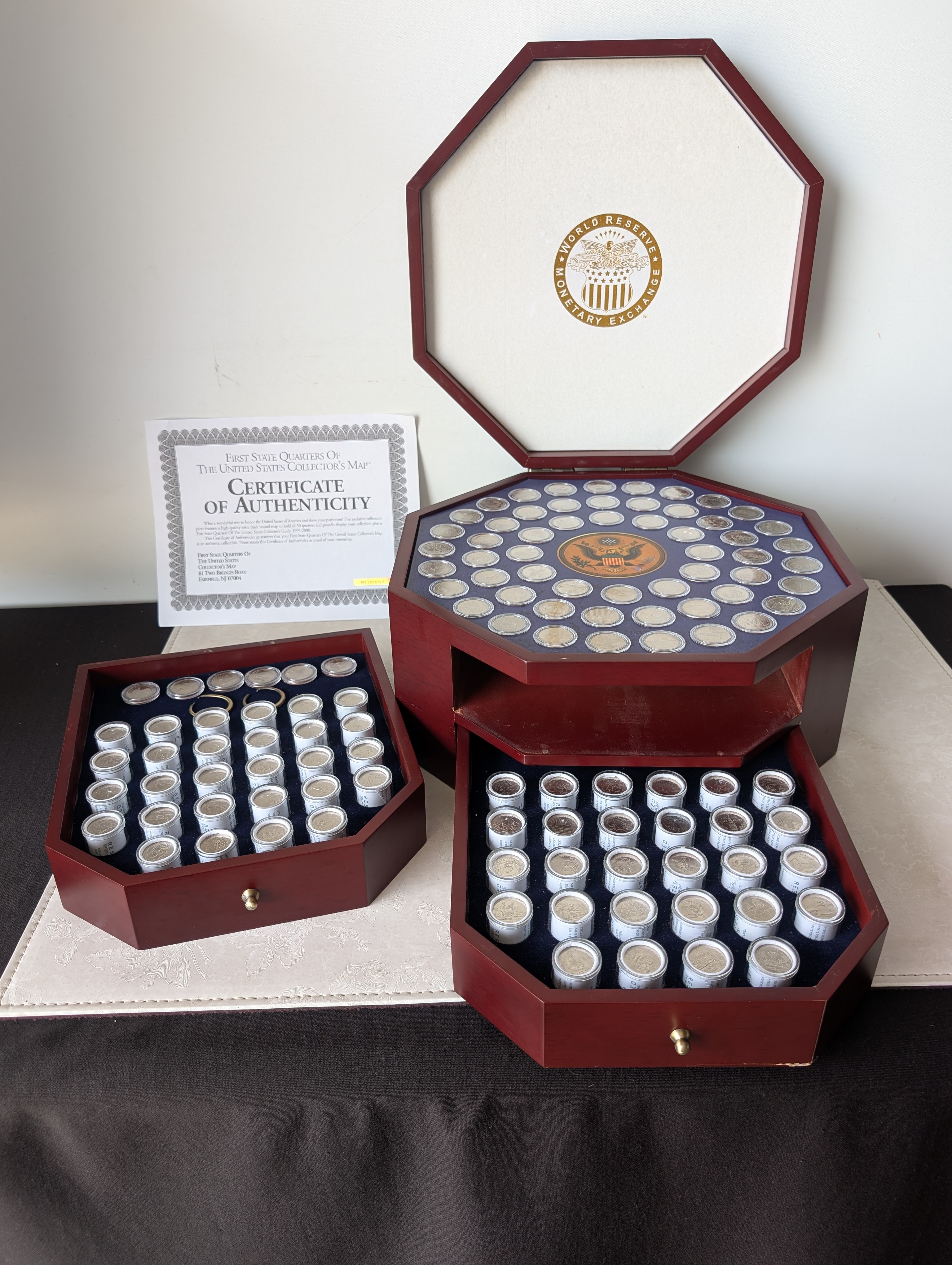 Complete Set of Denver Minted State and Territorial Quarters Single Coins and Capsules with 56 - $25 Uncirculated Half Dollar Rolls