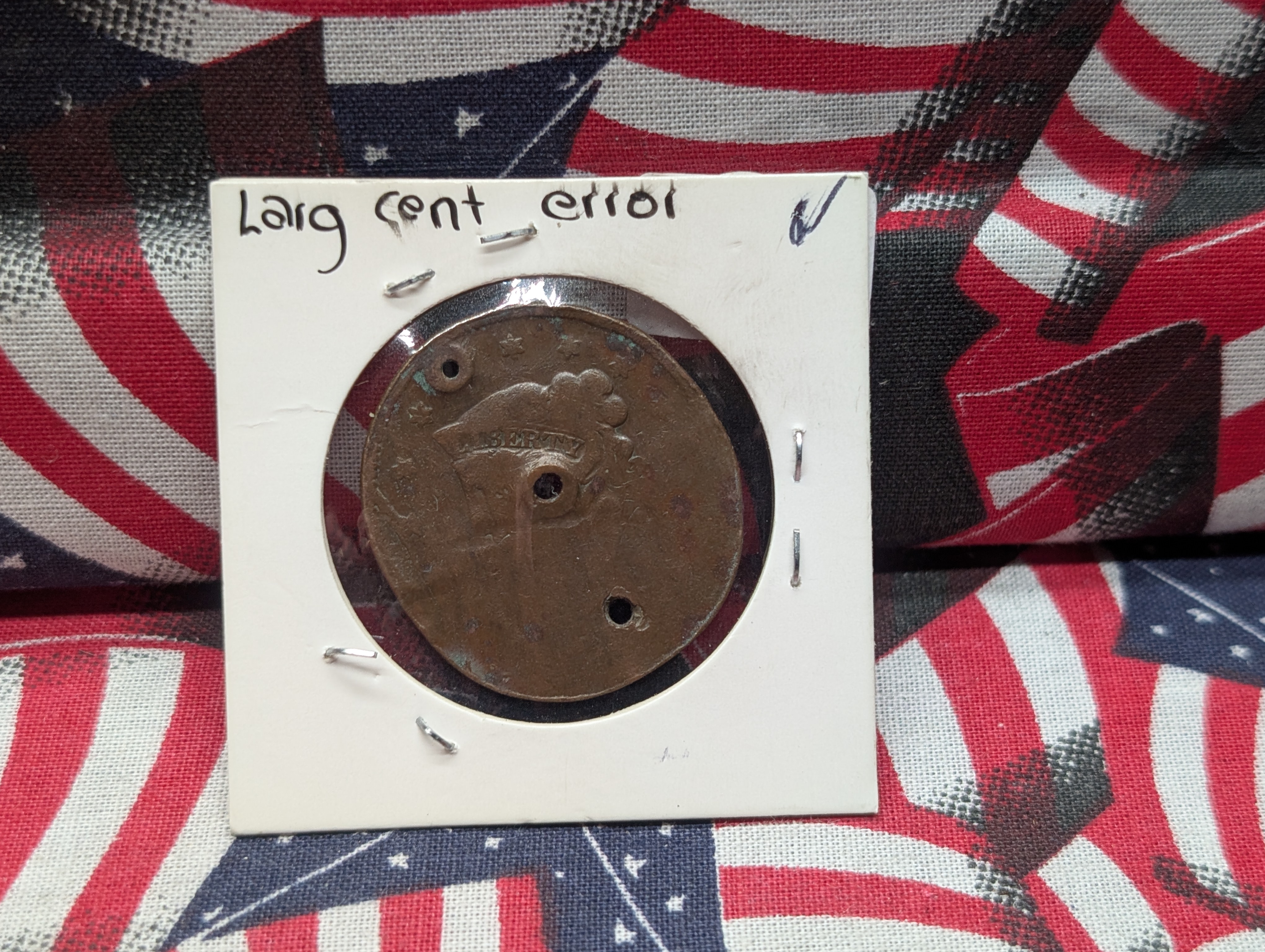 Large Cent (environmental damage / holed and damaged planchet)