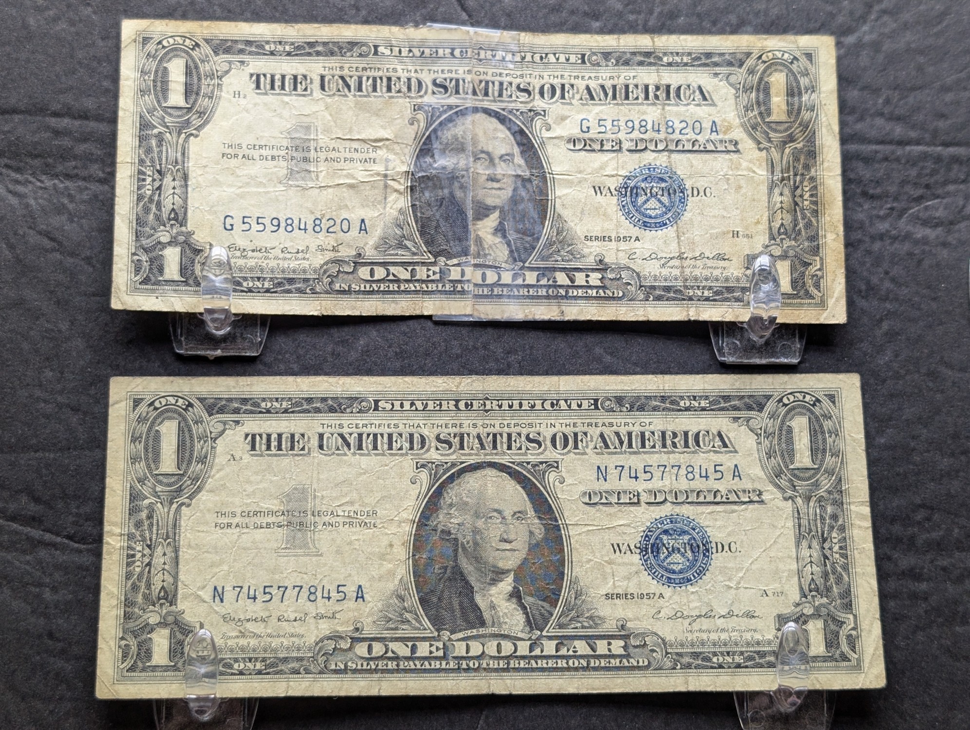 (2) 1957-A US $1 Silver Certificates - Blue Seals, Tape on One