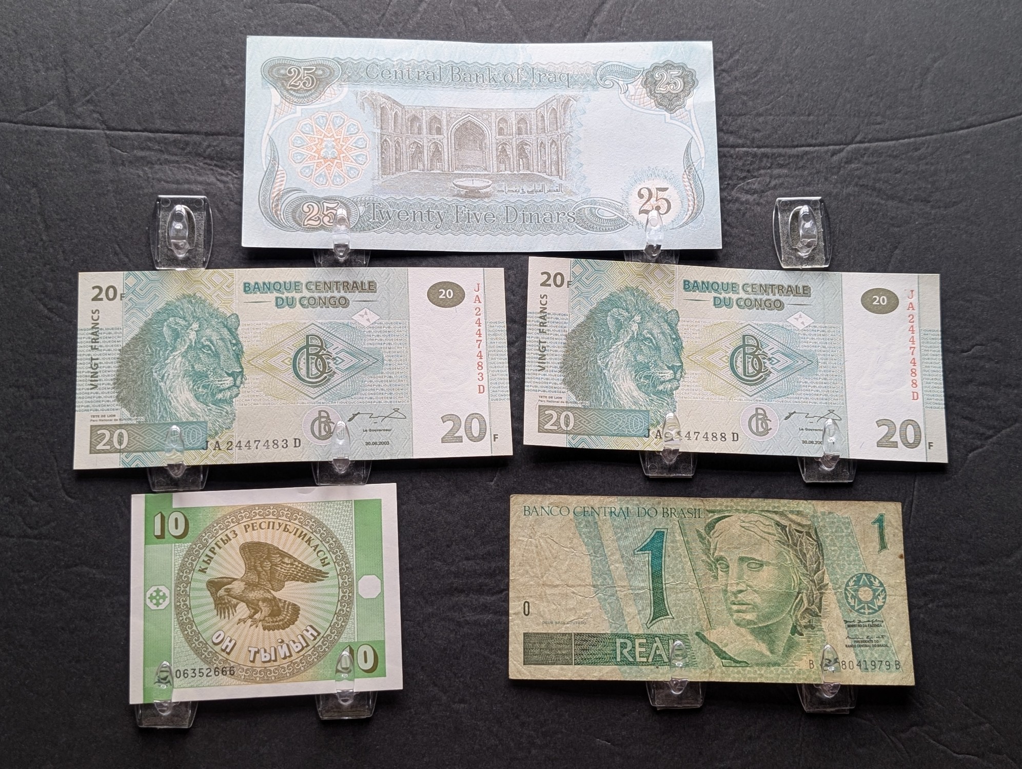 1990 West Asia 25 Dinars, (2) 2003 Congo 20 Francs, 1993 Kyrgyzstan 10 Tyiyn, and Brazil 1 Real Banknotes