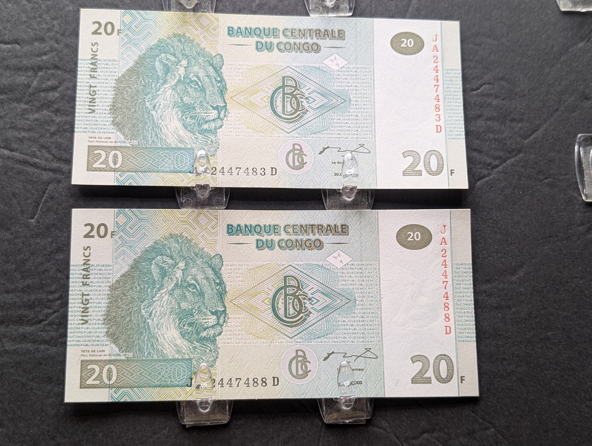 1990 West Asia 25 Dinars, (2) 2003 Congo 20 Francs, 1993 Kyrgyzstan 10 Tyiyn, and Brazil 1 Real Banknotes